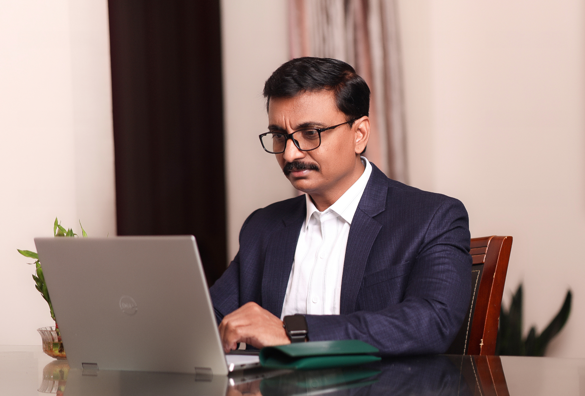 Founder reviewing business systems on laptop